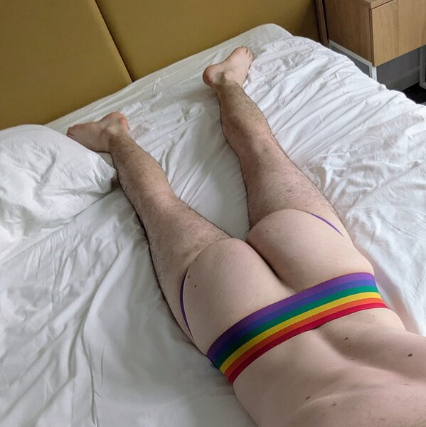 Myself in a jockstrap and nude on the hotel bed.